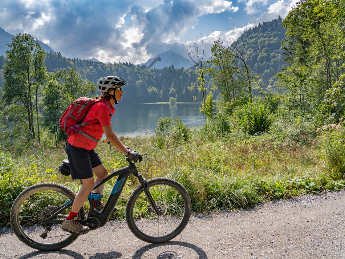 Senior woman riding her electric mountain bike.