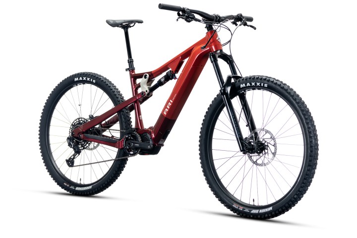 Red mountain bike with front and rear suspension on white background.