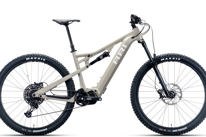 Gray mountain bike with thick tires and suspension.