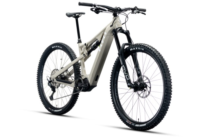 A modern electric mountain bike with black tires and beige frame.