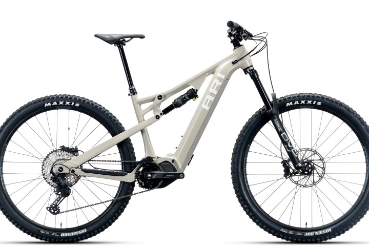 Beige mountain electric bike with black tires and modern suspension.