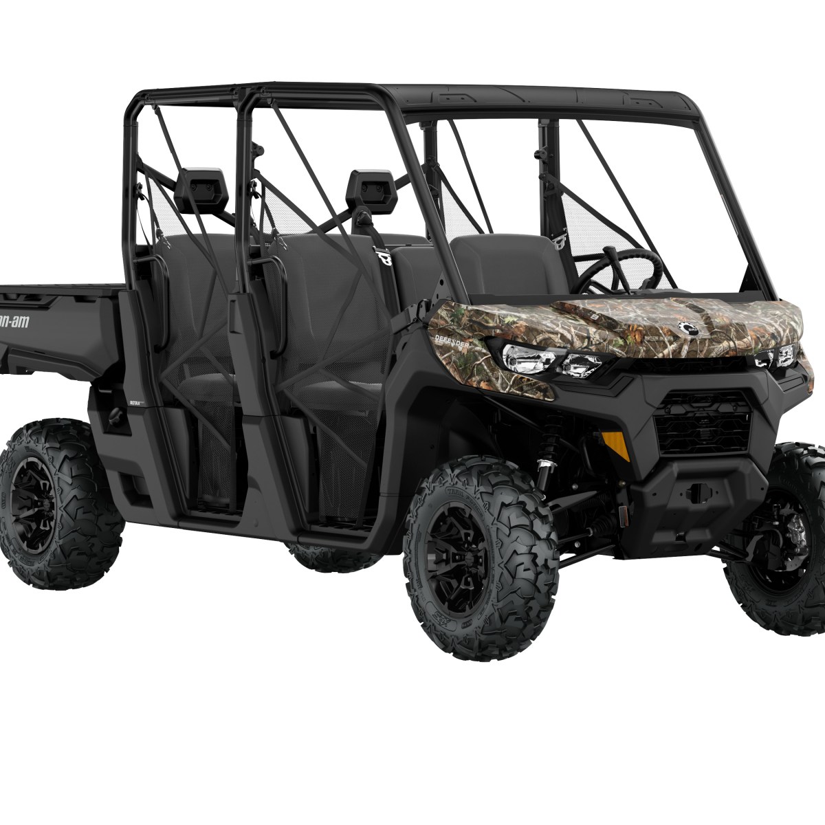 Camouflaged off-road vehicle with large tires and open cabin.