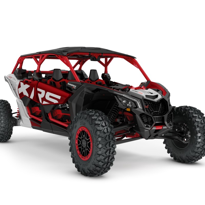 Red and black off-road vehicle with large tires and open cabin.