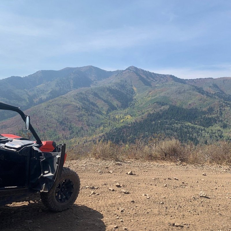 Photo of a Can-Am side-by-side vehicle stopped on the trail overlooking Heber Valley in Utah.