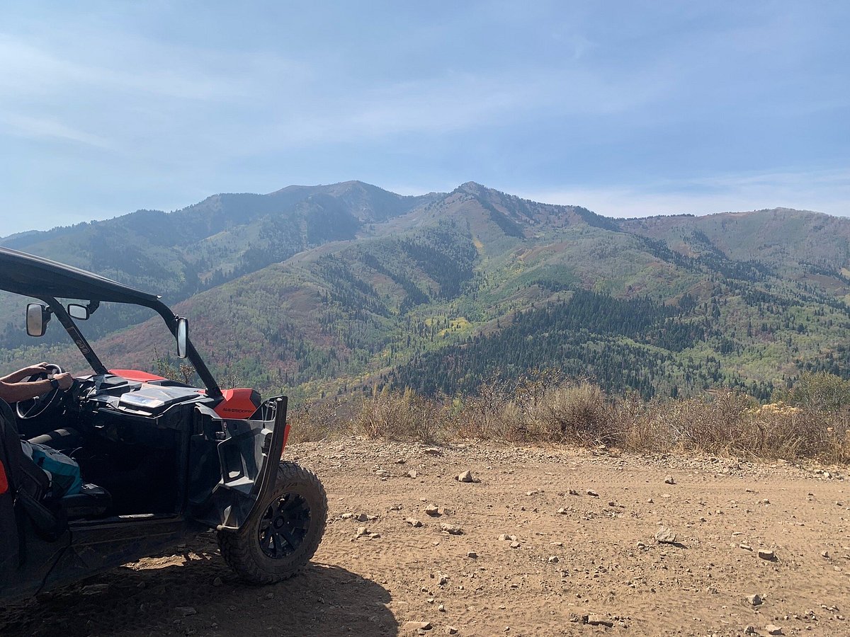 Photo of a Can-Am side-by-side vehicle stopped on the trail overlooking Heber Valley in Utah.