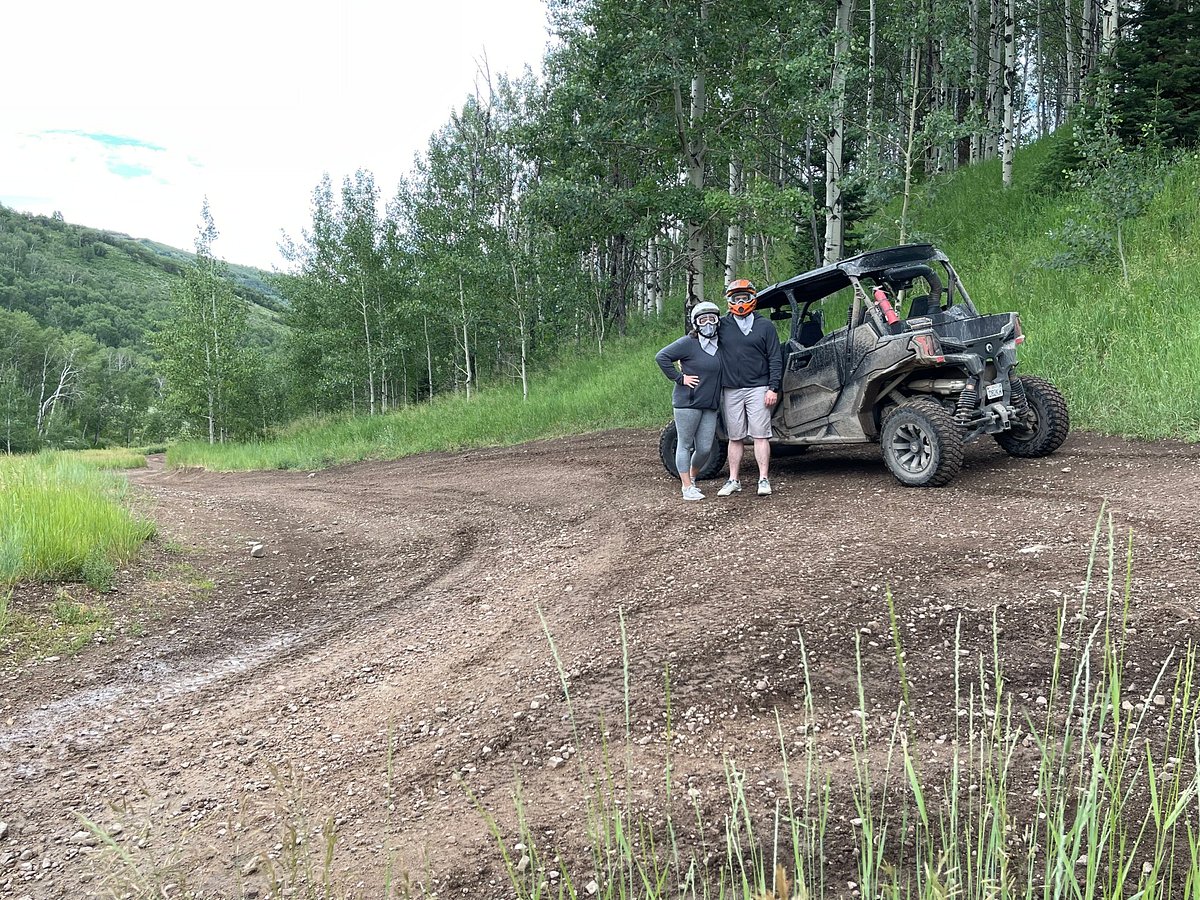 A couple stopped on the trail for a photo in front of the Can-Am UTV rental in Utah.